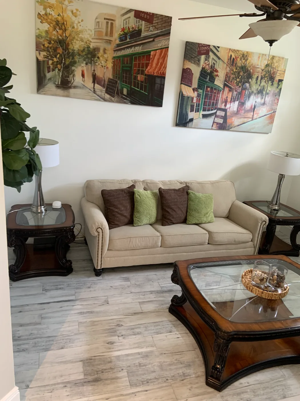 Family room with sofa, glass tables and tile floors cleaned